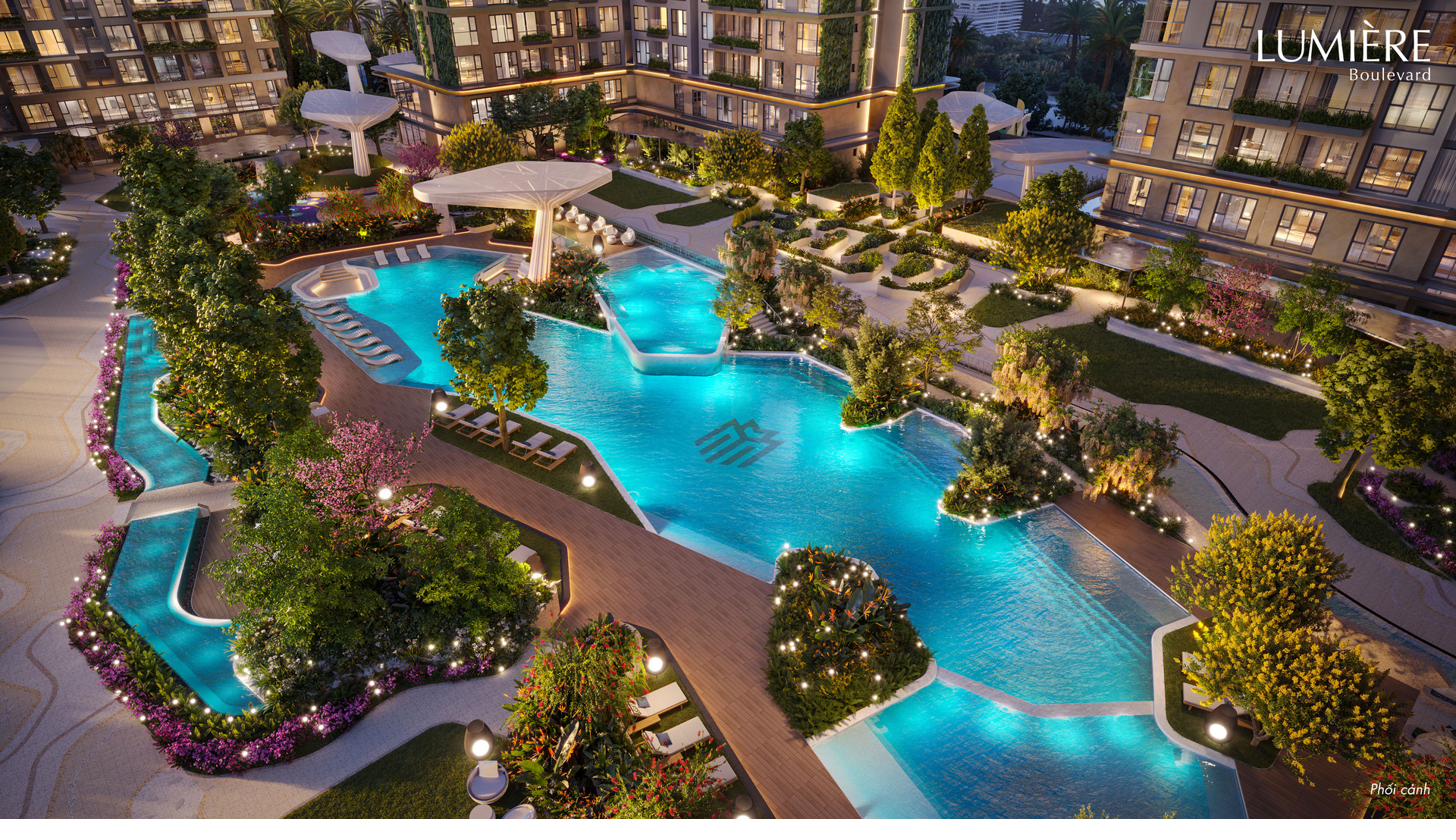 Aerial view of the lagoon pools winding through the gardens at night